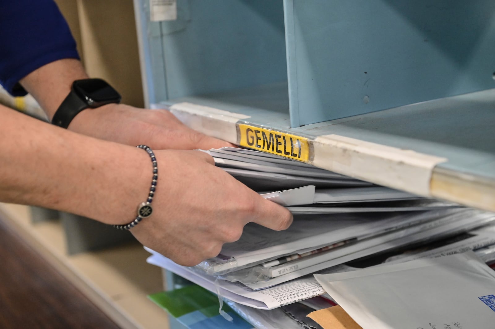 An employee of the Belsito postal distribution center in Rome sorts letters addressed to Pope Francis, who is currently being treated at Rome's Agostino Gemelli Polyclinic for bilateral pneumonia, Wednesday, March 19, 2025. (AP Photo/Chris Warde-Jones)