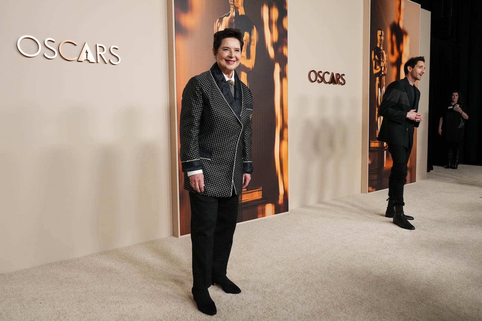 Isabella Rossellini, left, and Adrien Brody arrive at the Oscars Nominees Dinner on Tuesday, Feb. 25, 2025, at the Academy Museum of Motion Pictures in Los Angeles. (Photo by Jordan Strauss/Invision/AP)