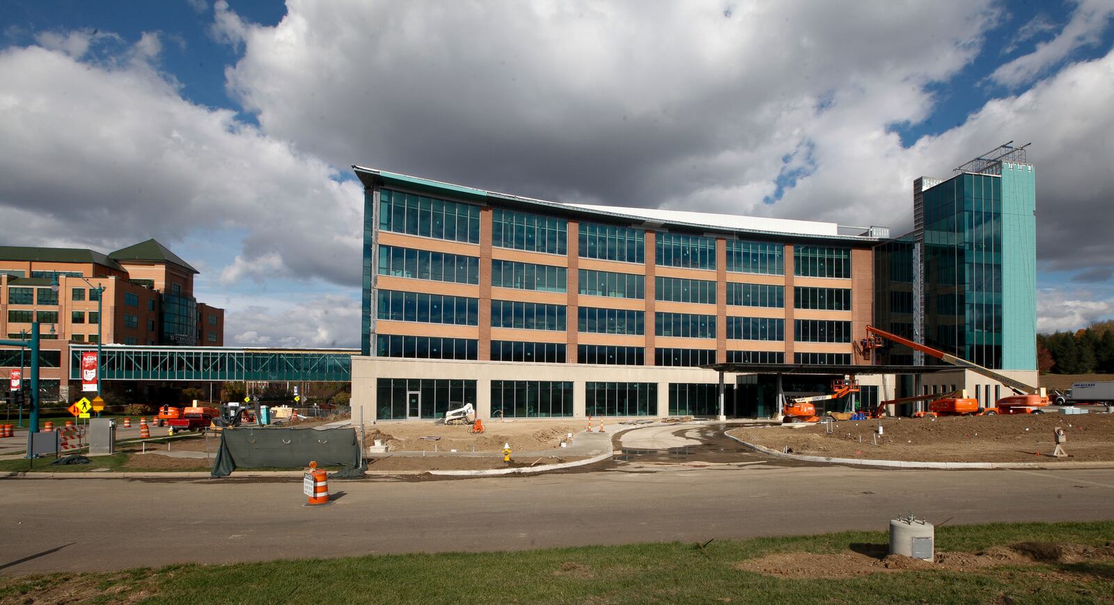 Construction nears completion on Kettering Health Network’s new cancer center connected to Kettering Medical Center by a bridge across Southern Boulevard. The new five-story building will house 30 cancer specialists. A patient advisory council helped design the facility. CHRIS STEWART / STAFF