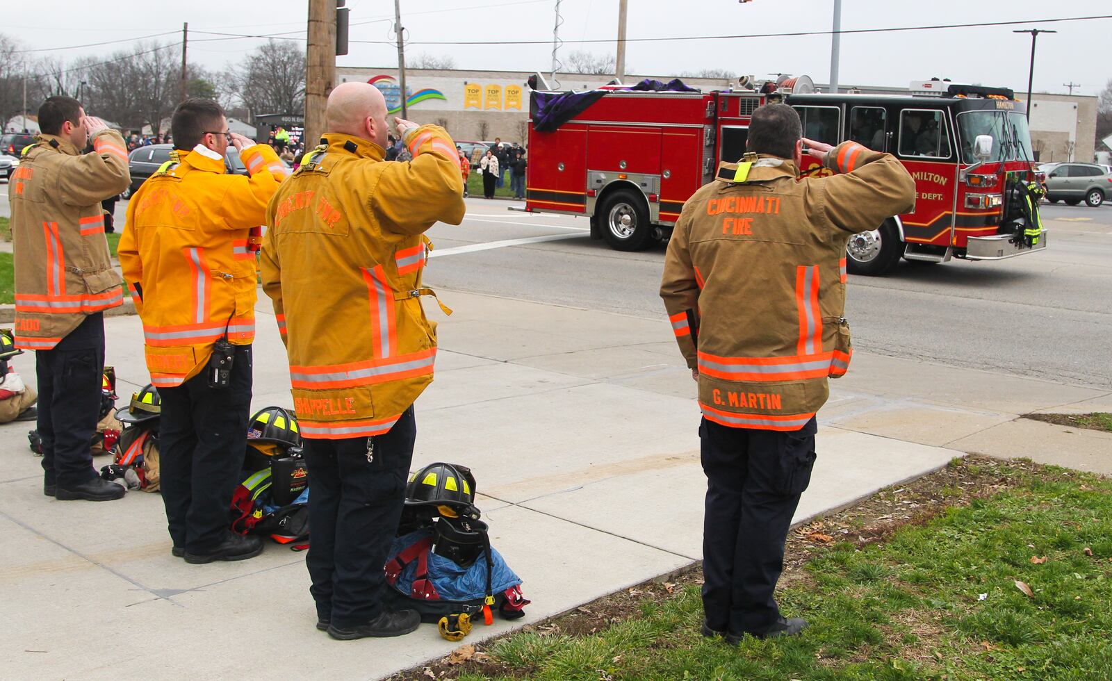 The funeral procession for Hamilton firefighter Patrick Wolterman passes by his fire station. Wolterman died in 2015 from injuries he sustained when he fell through the first floor of a home while battling a fire on Pater Avenue. 