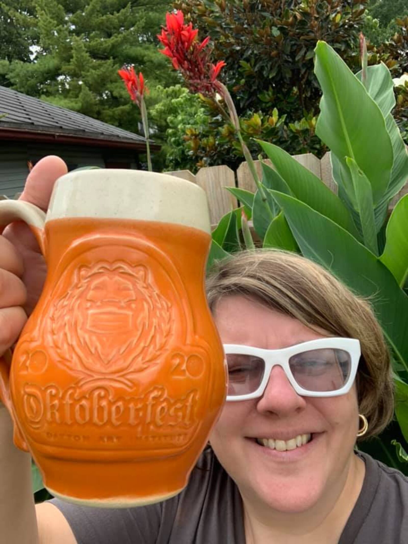 Alexis Larsen, Dayton Art Institute External Affairs Director, with the 2020 Oktoberfest mug. CONTRIBUTED