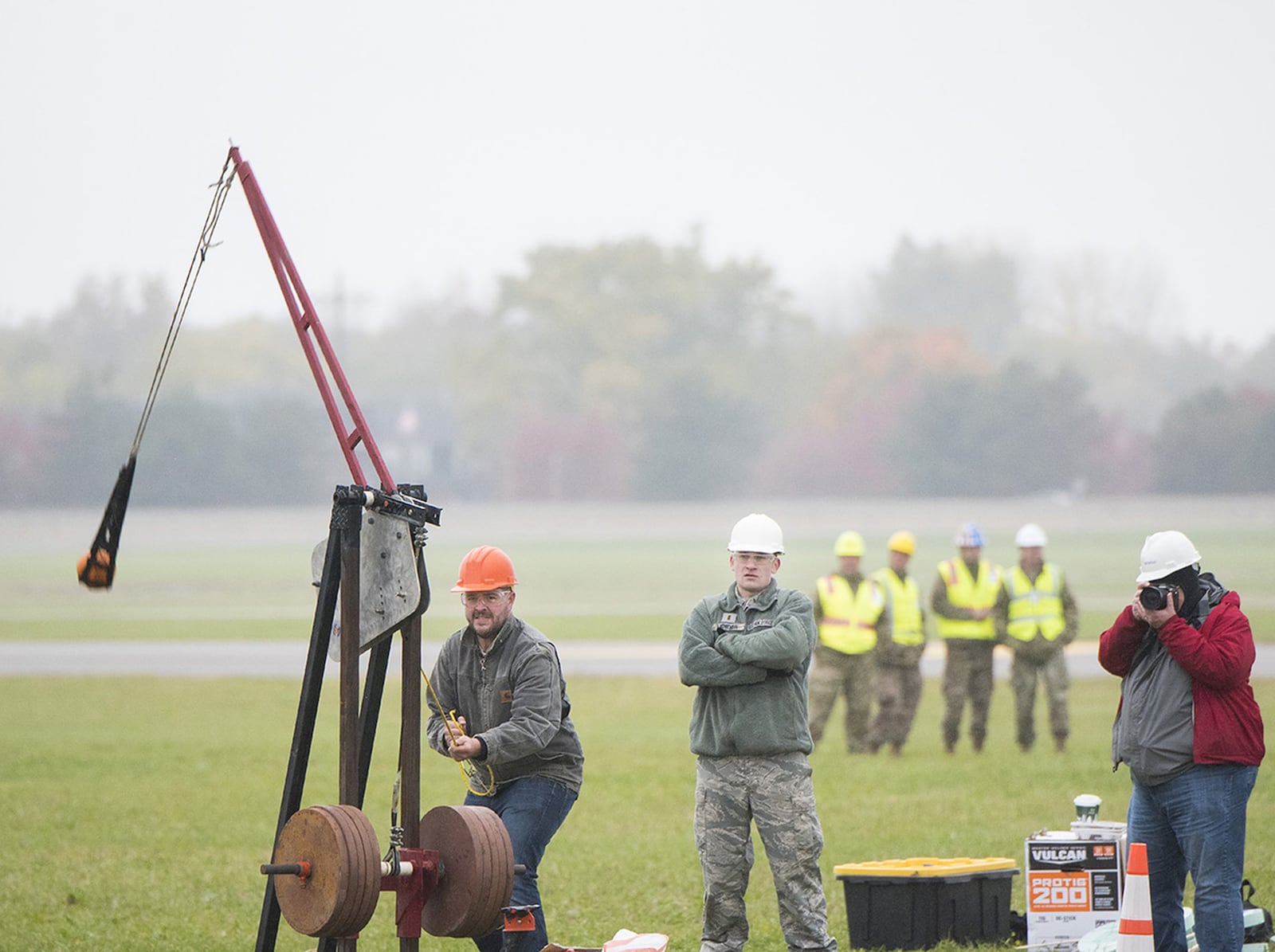 An Air Force Life Cycle Management Center’s F-15 Engineering Branch team member pulls the trigger on their trebuchet-style catapult to hurl a small pumpkin during the 14th annual Wright-Patterson Air Force Base pumpkin chuck event. (U.S. Air Force photo/R.J. Oriez)