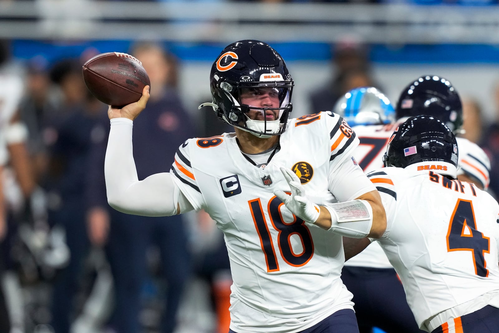 Chicago Bears quarterback Caleb Williams (18) throws against the Detroit Lions during the first half of an NFL football game, Sunday, Nov. 17, 2024, in Detroit. (AP Photo/Carlos Osorio)