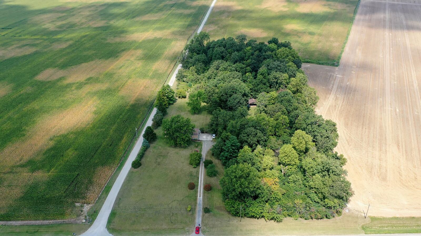 The home sits 300 feet off the road in a wooded area.