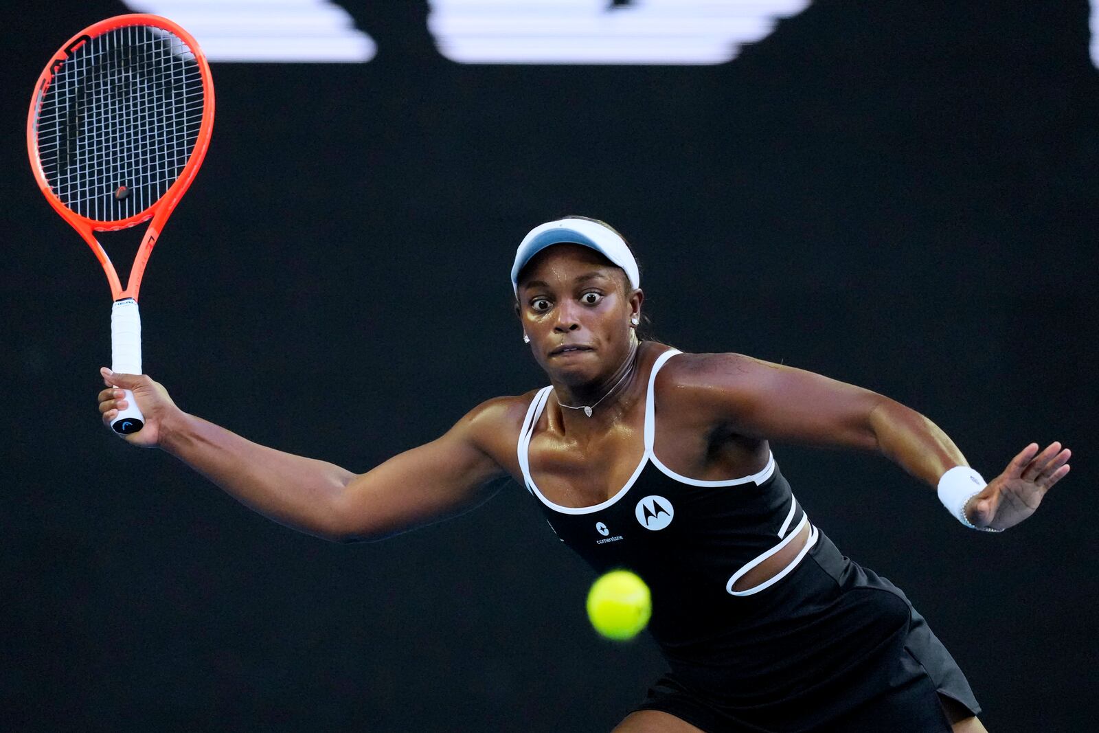 Sloane Stephens of the U.S. plays a forehand return to Aryna Sabalenka of Belarus during their first round match at the Australian Open tennis championship in Melbourne, Australia, Sunday, Jan. 12, 2025. (AP Photo/Vincent Thian)