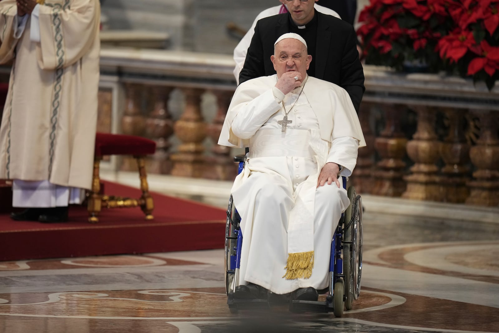 Pope Francis leaves at the end of a mass in St. Peter's Basilica at The Vatican on New Year's Day, Wednesday, Jan. 1, 2025. (AP Photo/Andrew Medichini)