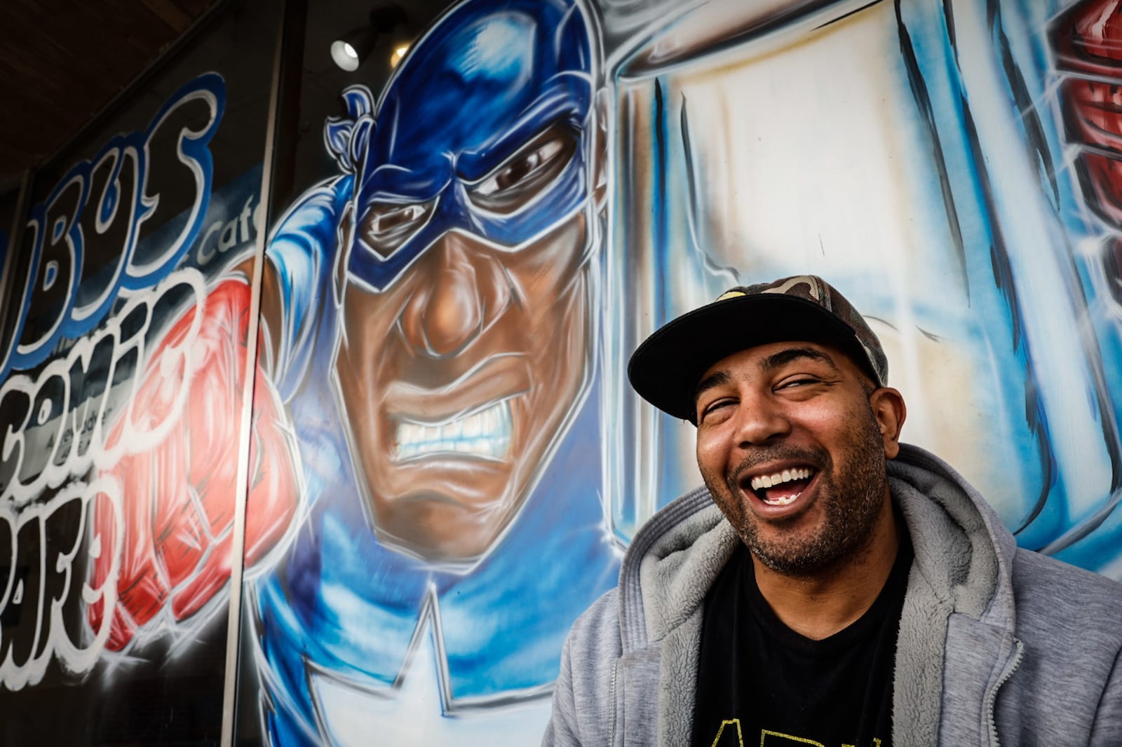 Rob Dejene is the owner of Nimbus Comic Cafe on East Main Street in Trotwood. Dejene sells coffee and vintage comic books. JIM NOELKER/STAFF