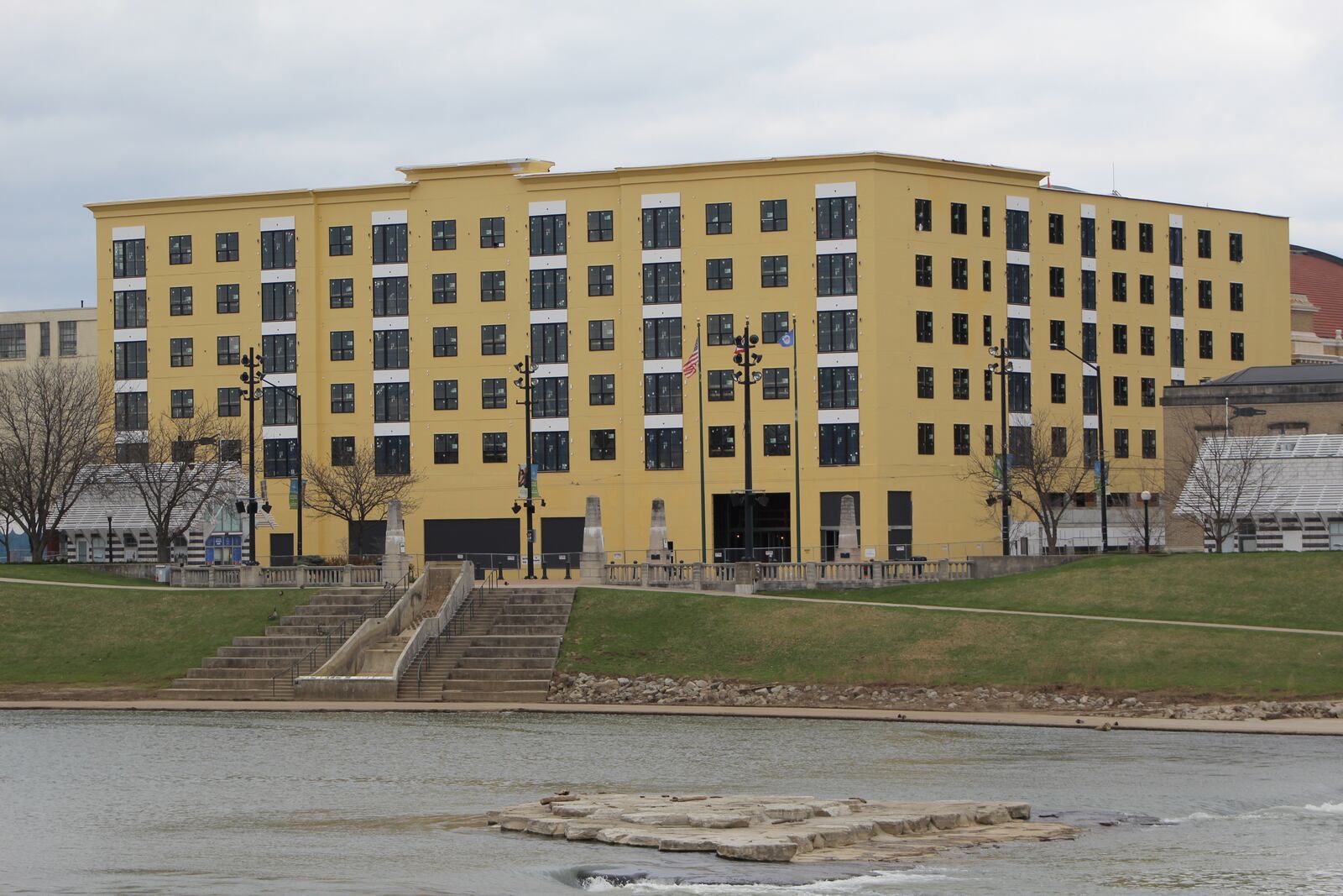 Work continues on the Monument apartments across from RiverScape in downtown Dayton. CORNELIUS FROLIK / STAFF