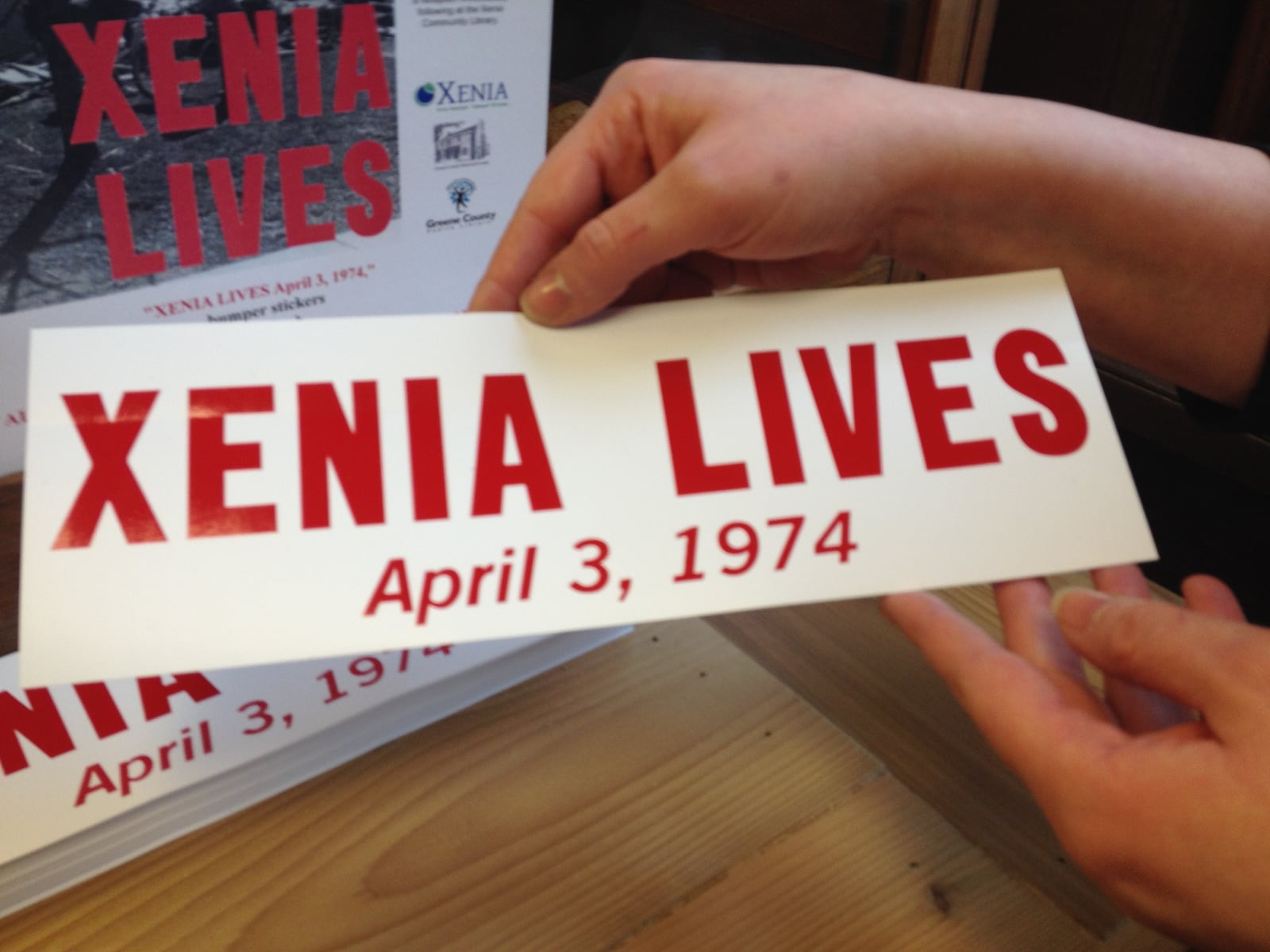 After the 1974 tornado, the Aldine Printing Company produced the Xenia Lives bumper stickers. Recently, The Greene County Library and the City of Xenia had the bumper stickers reprinted to help raise money for survivors of the Moore, Okla. tornado in 2013.