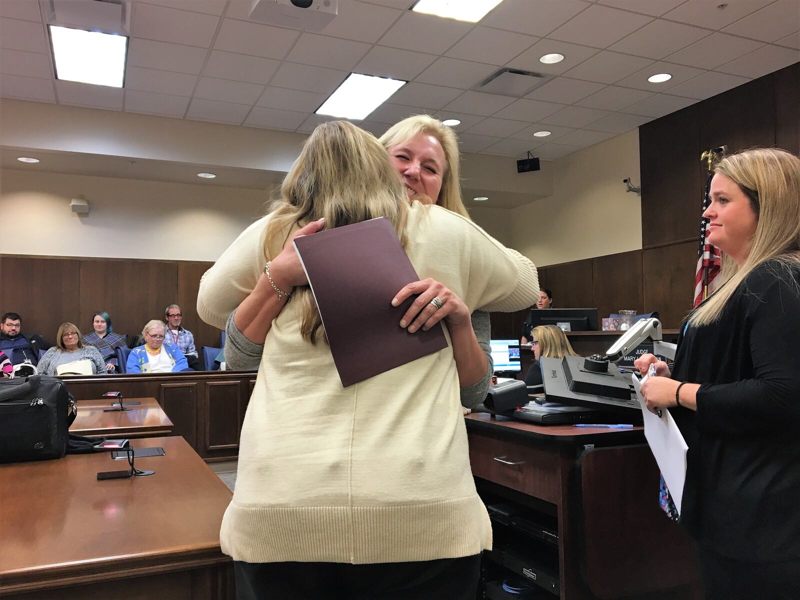 Melissa Rodgers is congratulated by court staff at her graduation from Montgomery County's Women's Therapeutic Drug Court in October 2018. KATIE WEDELL/STAFF