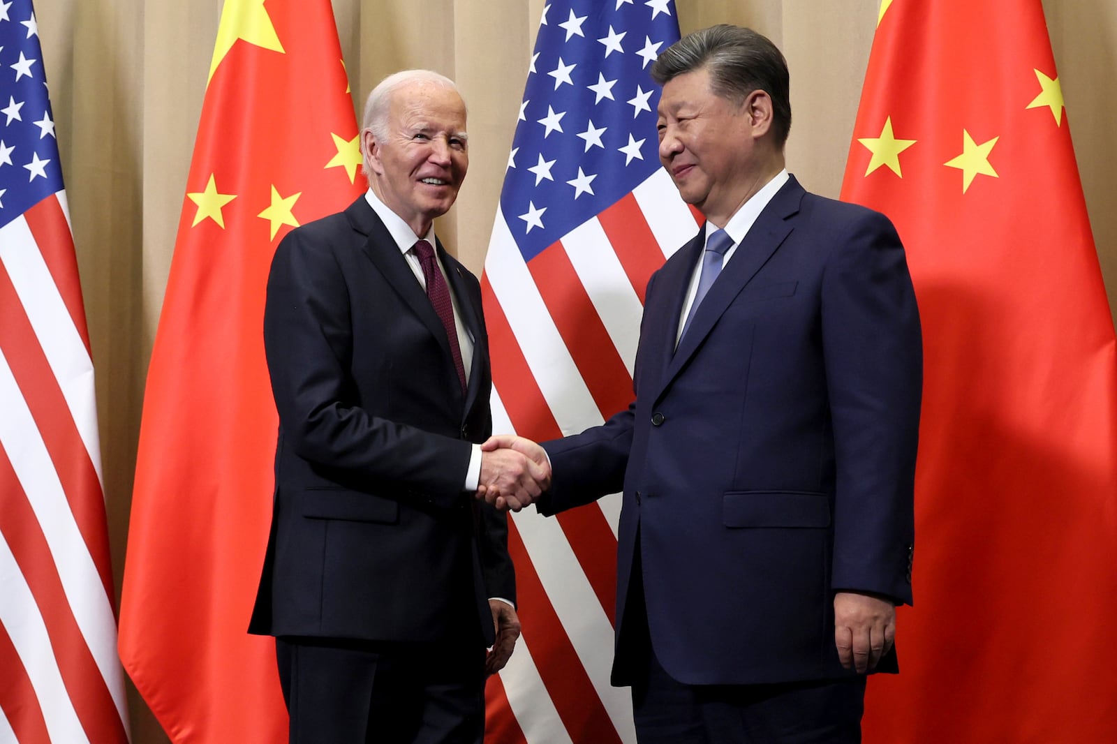 President Joe Biden shakes hands with Chinese President Xi Jinping before a bilateral meeting, Saturday, Nov. 16, 2024, in Lima, Peru. (Leah Millis/Pool Photo via AP)