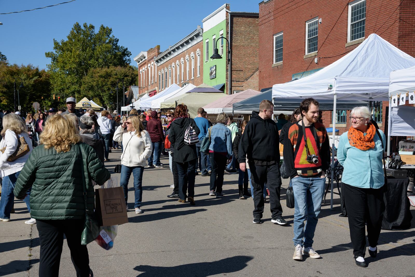 The Yellow Springs Street Fair and Music & Beer Fest — a day of art, music, street performers, food and beer — took over the downtown Yellow Springs on Saturday, Oct. 12. The street fair featured more than 250 handmade arts and crafts vendors, live music and local craft beer. TOM GILLIAM / CONTRIBUTING PHOTOGRAPHER