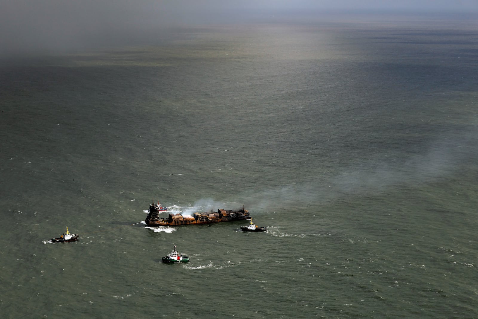 Smoke billows from the MV Solong cargo ship in the North Sea, off the Yorkshire coast, Tuesday, March 11, 2025, in England. (Dan Kitwood/Pool Photo via AP)