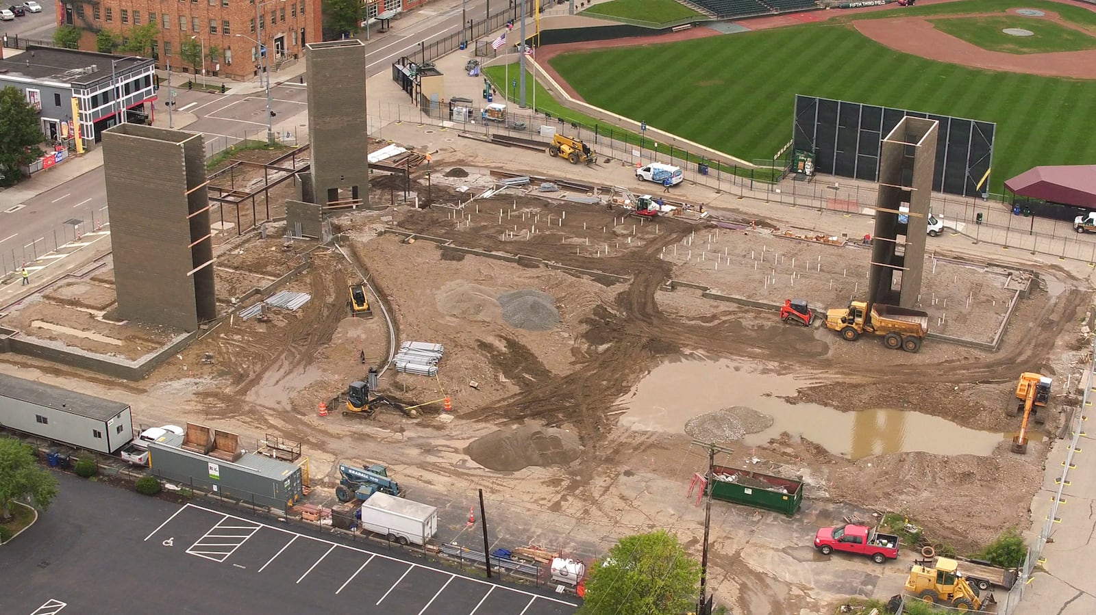 Construction is underway for a new apartment building that is located just beyond the outfield at Fifth Third Field in downtown Dayton. Centerfield Flats is a 112 unit, L-shaped building being built by Woodard Development that will add to the hundreds of apartments and condos built downtown in the past few years.  The five-story modern brick design will include stadium seating in a community room for views of the ballpark.  The building is about 120,000 square feet.  Units will range in size, offering between 532-square-foot studios to 1,717-square-foot units with three bedrooms.  Construction on the apartments is expected to take 12 to 13 months, with units opening in the summer of 2019.   TY GREENLEES / STAFF