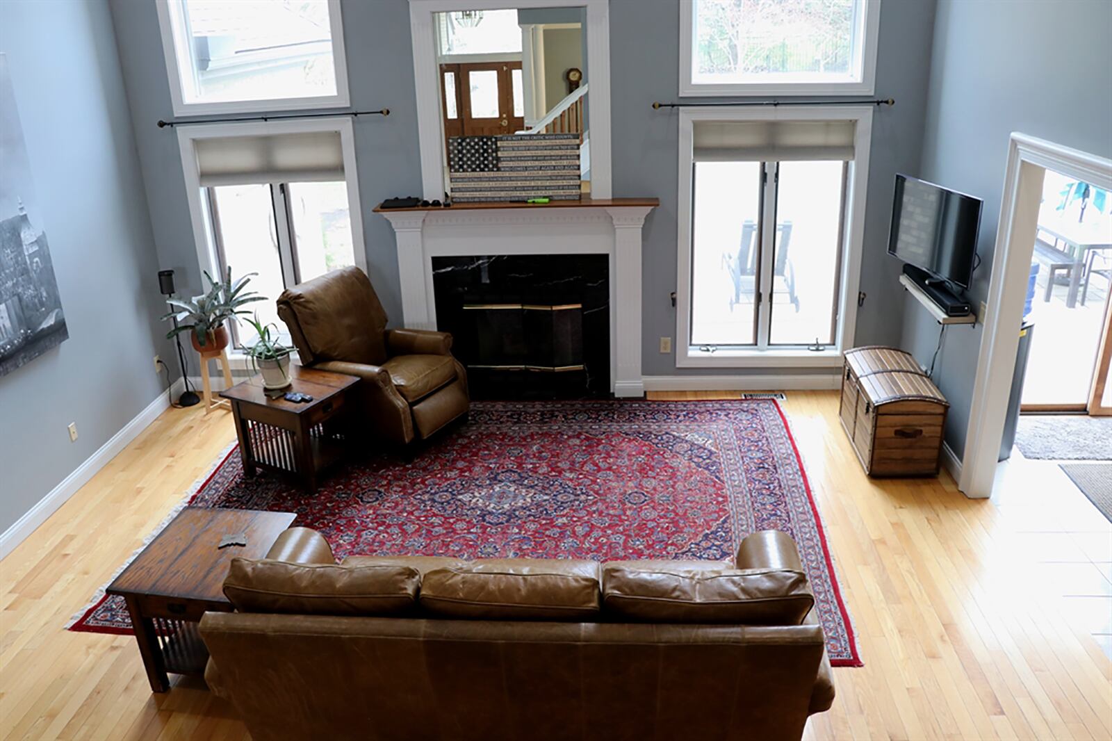 The 2-story great room has hardwood flooring and a wall of windows that surround the gas fireplace with fluted wood mantel. An open staircase ascends up the wall to the second floor where 4 bedrooms and 2 full bathrooms are located.
CONTRIBUTED PHOTO BY KATHY TYLER