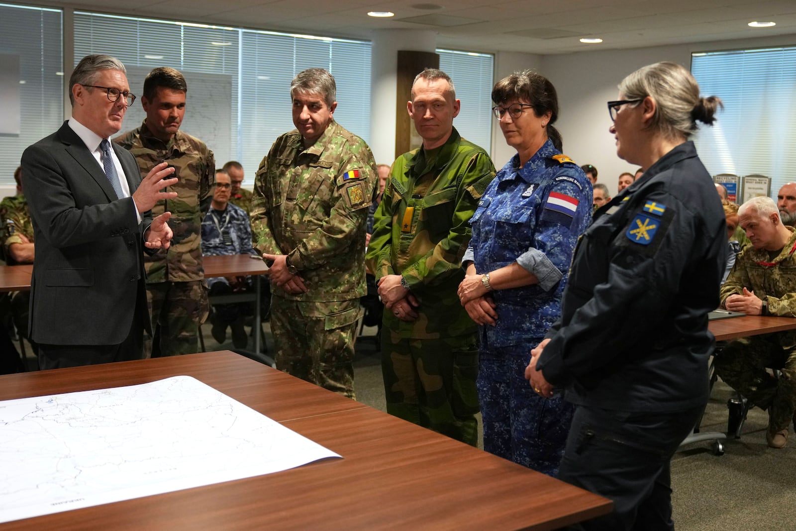 Britain's Prime Minister Keir Starmer speaks during a visit to a military base to meet planners mapping out next steps in the Coalition of the Willing in Northwood, London, Thursday, March 20, 2025.(AP Photo/Alastair Grant, Pool)