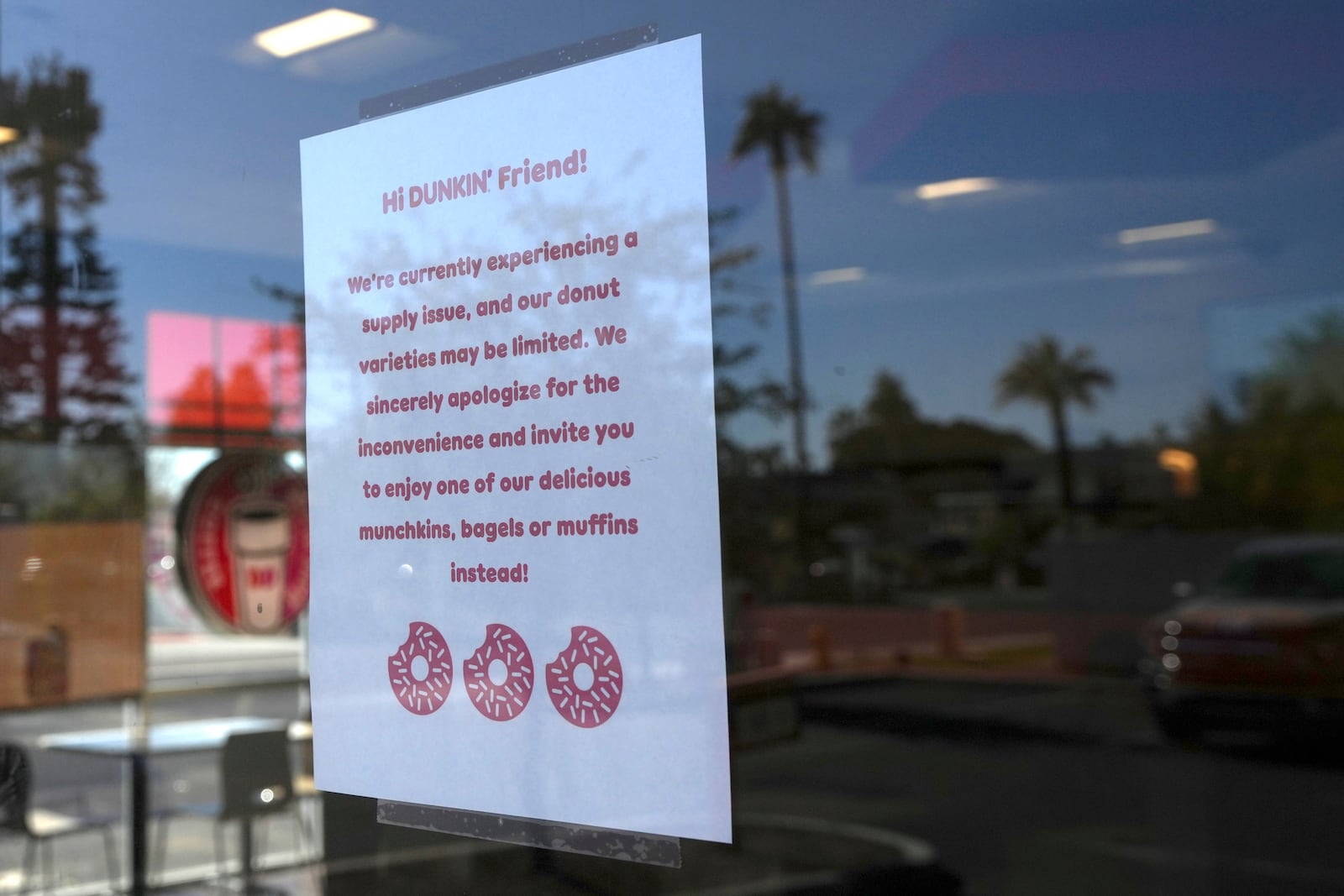 A sign on the door of a Dunkin' Donuts restaurant explains that customers will find limited doughnut selections for sale Friday, Jan. 10, 2025, in Tempe, Ariz. (AP Photo/Ross D. Franklin)