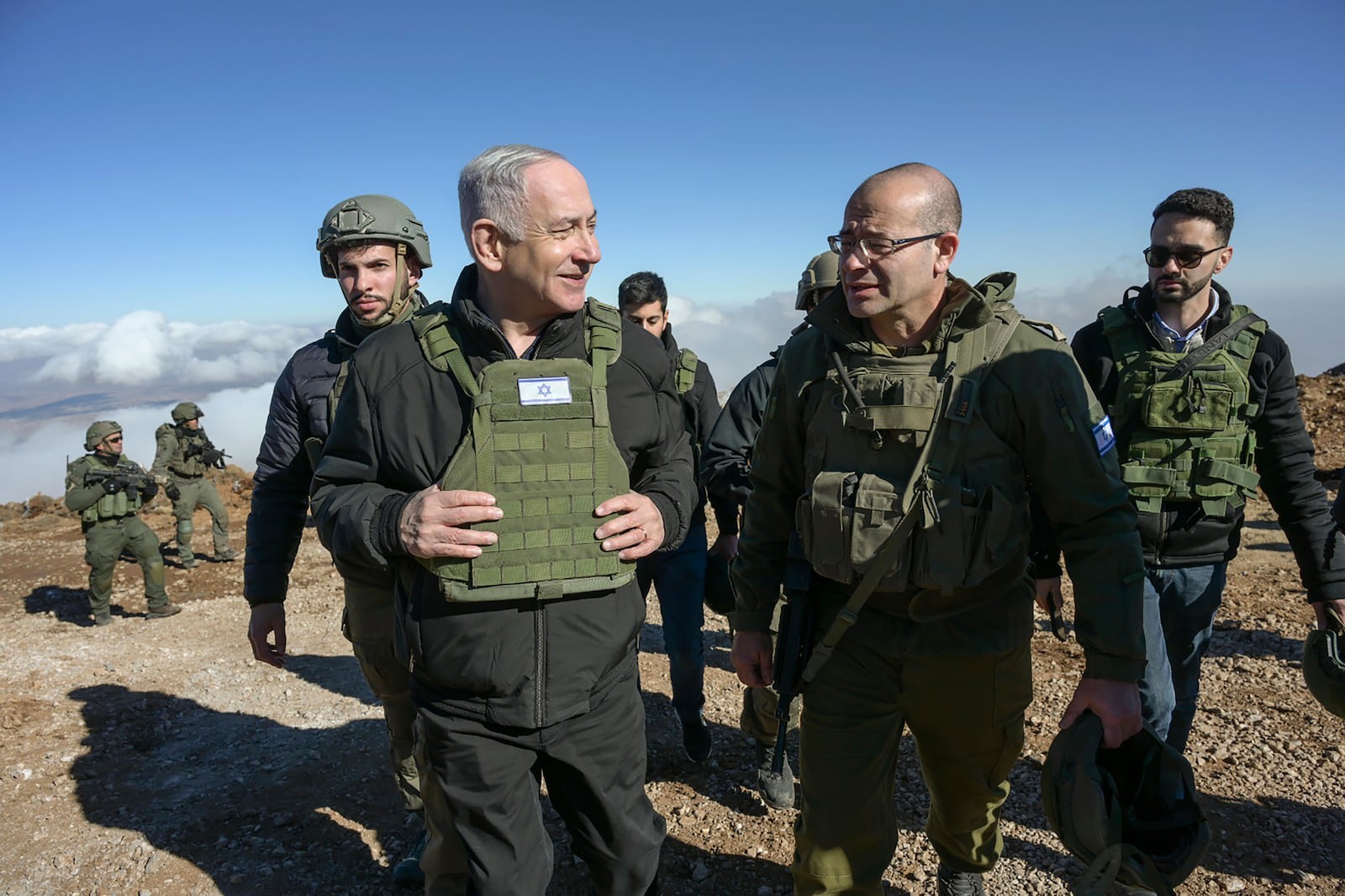 Israel's Prime Minister Benjamin Netanyahu, left, visits Israeli forces in a buffer zone inside Syria, Tuesday, Dec. 17, 2024. (Israel Government Press Office via AP)