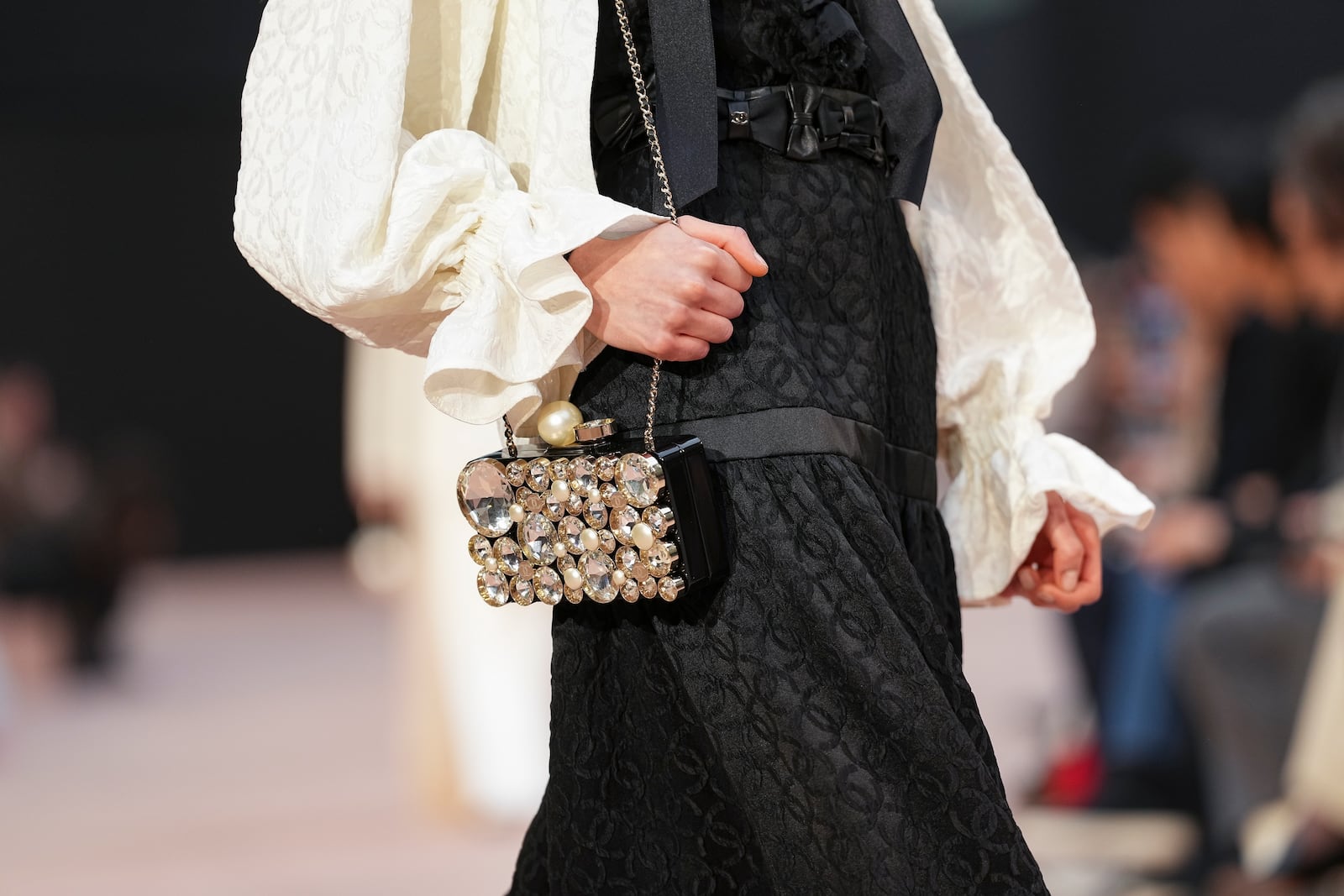 A model wears a creation as part of the Chanel Fall/Winter 2025-2026 Womenswear collection presented Tuesday, March 11, 2025. in Paris. (Photo by Scott A Garfitt/Invision/AP)