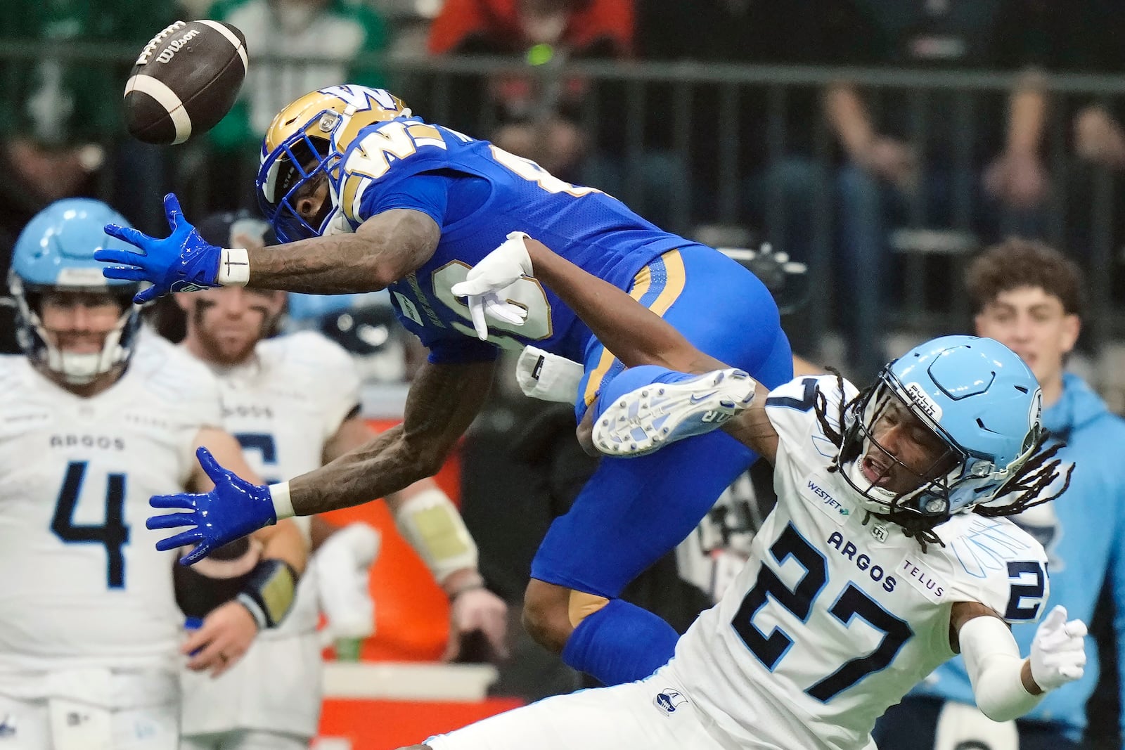 Winnipeg Blue Bombers' Keric Wheatfall (88) can't make the catch as Toronto Argonauts' Mark Milton (27) defends during the second half of a CFL football game at the 111th Grey Cup in Vancouver, British Columbia, Sunday, Nov. 17, 2024. (Frank Gunn/The Canadian Press via AP)