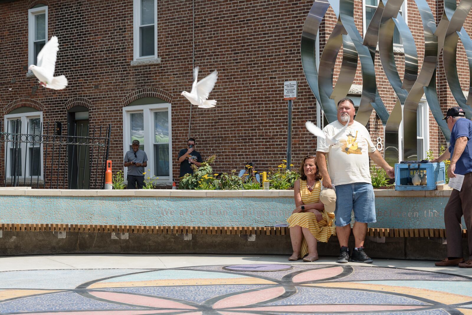 Here are scenes from the unveiling and dedication ceremony for The Seed of Life 8/4 Memorial, located at 530 E. Fifth St. in The Oregon District next to The Trolley Stop on Sunday, Aug. 4, 2024. The memorial, created to honor the victims of the Aug. 4, 2019 Oregon District shooting, is a collaboration by Terry Welker, Jes McMillan, Sierra Leone, and James Pate with help from 5,000 volunteers. TOM GILLIAM / CONTRIBUTING PHOTOGRAPHER