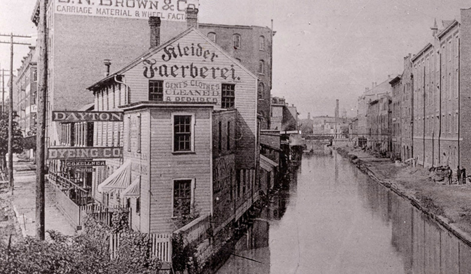 The Sachs Pruden Brewery on the right in what is now the temporary Dayton Metro Library, formerly Hauer Music in a
view looking up the Miami Erie from Fifth Street.
Creator 	Lutzenberger, William, 1853-1941.
PHOTO COURTESY OF DAYTON METRO LIBRARY / LUTZENBERGER PICTURE COLLECTION