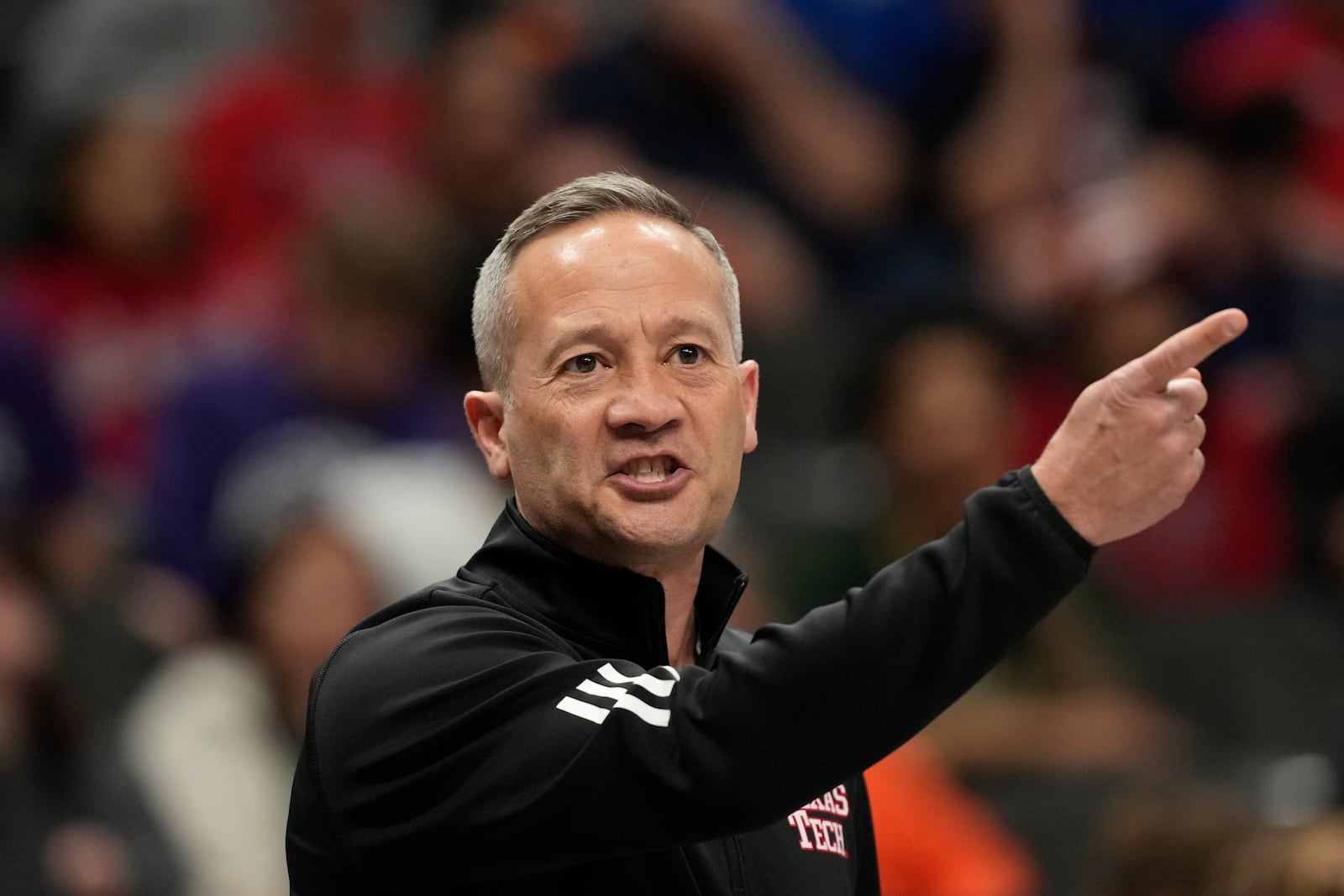 Texas Tech head coach Grant McCasland is seen on the sidelines during the first half of an NCAA college basketball game against Arizona in the semifinal round of the Big 12 Conference tournament, Friday, March 14, 2025, in Kansas City, Mo. (AP Photo/Charlie Riedel)