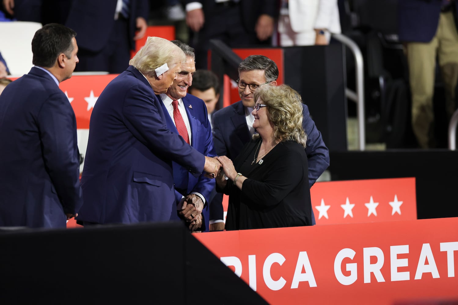 
                        Former President Donald Trump, the Republican presidential nominee, greets Beverly, the mother of Sen. JD Vance (R-Ohio), the Republican vice presidential nominee,  on the third night of the Republican National Convention at the Fiserv Forum in Milwaukee, on Wednesday, July 17, 2024. From left: Trump, Gov. Doug Burgum of North Dakota, House Speaker Mike Johnson (R-La.) and Beverly Vance. (Maddie McGarvey/The New York Times)
                      