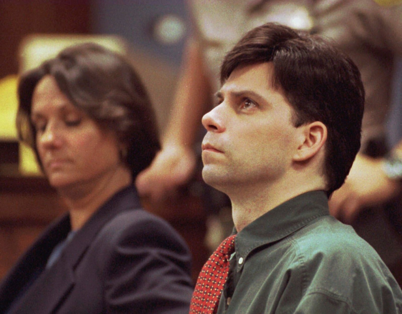 FILE - Lyle Menendez looks up during testimony in his and brother Erik's retrial for the shotgun slayings of their parents, Oct. 20, 1995 in Los Angeles. (Steve Grayson/Pool Photo via AP, File)