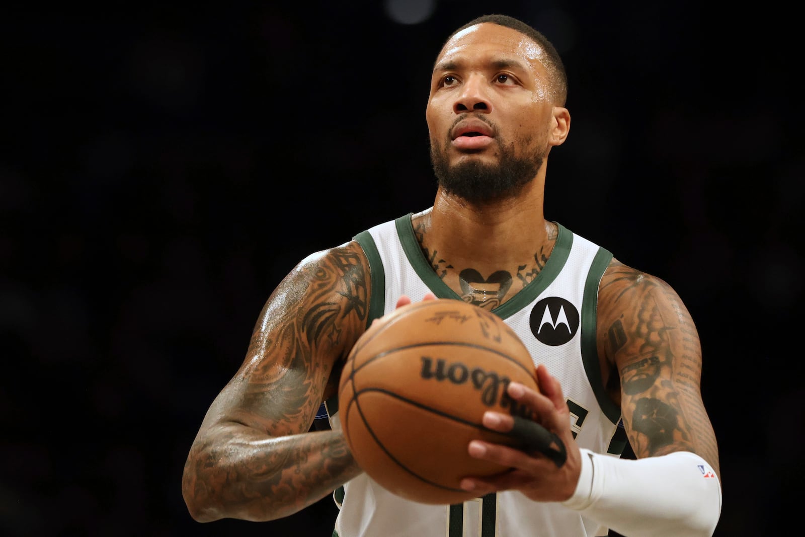 Milwaukee Bucks' Damian Lillard prepares to shoot during the first half of an NBA basketball game against the Brooklyn Nets, Sunday, Dec. 8, 2024, in New York. (AP Photo/Heather Khalifa)