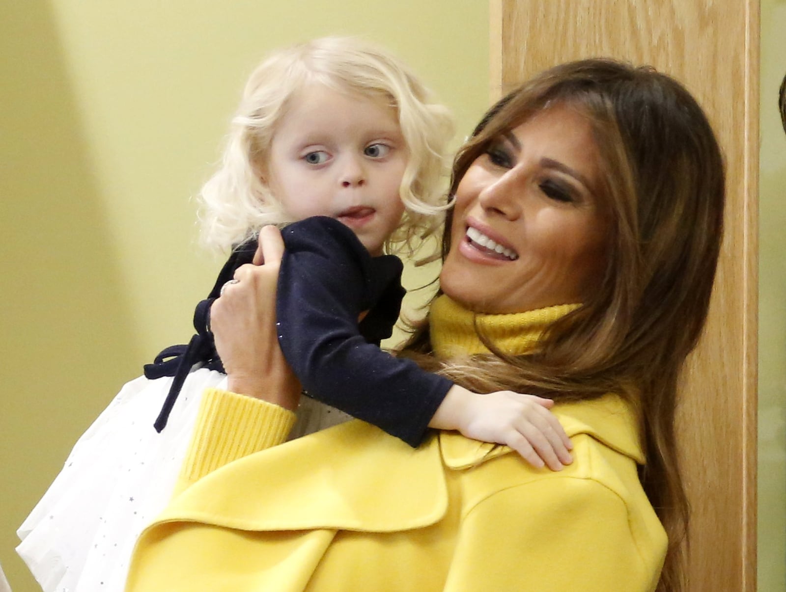 First Lady Melania Trump greets a child during a visit to Cincinnati Children’s Monday. LISA POWELL / STAFF