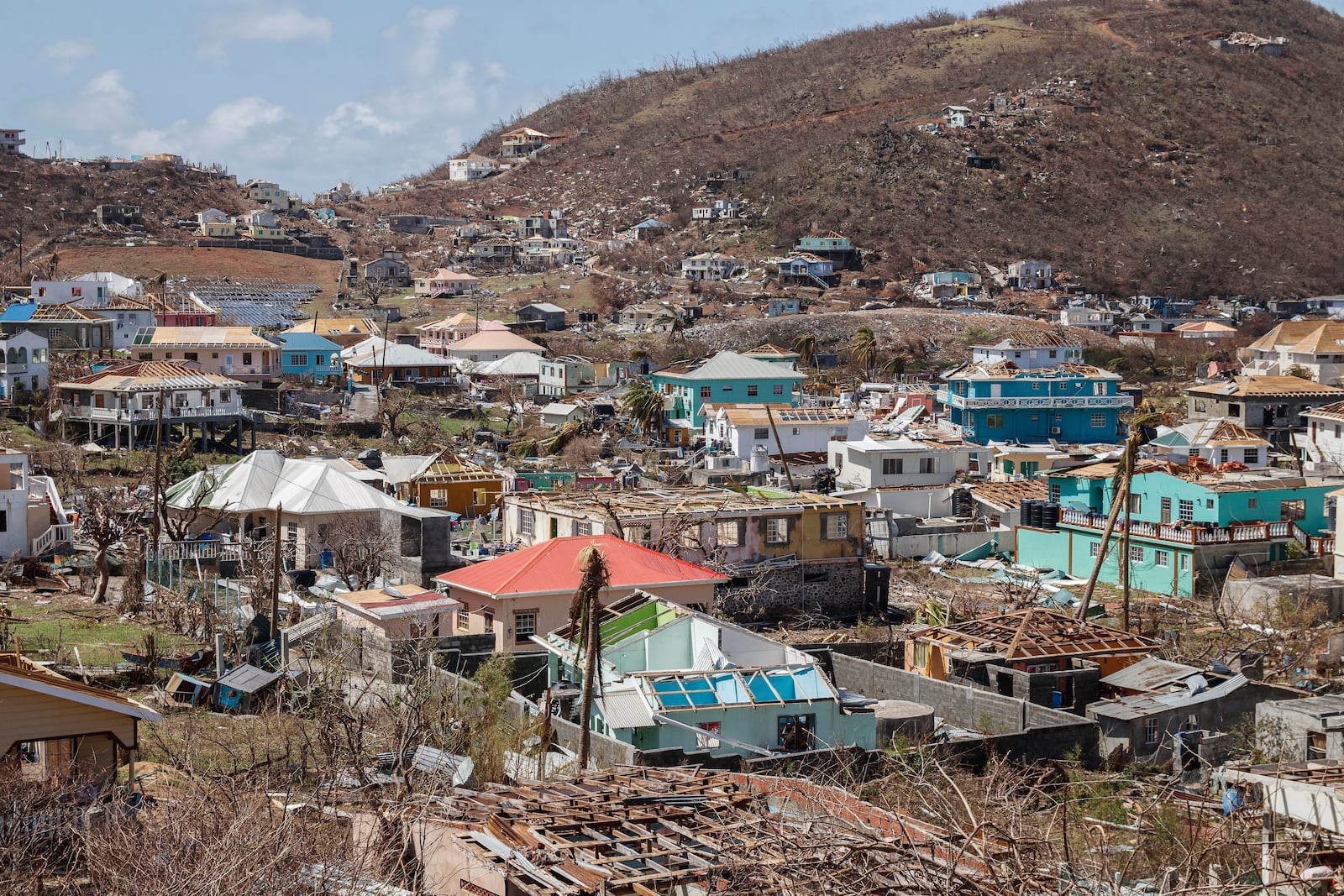 FILE - Homes destroyed by Hurricane Beryl sit in Clifton, Union Island, St. Vincent and the Grenadines, July 4, 2024. (AP Photo/Lucanus Ollivierre, File)