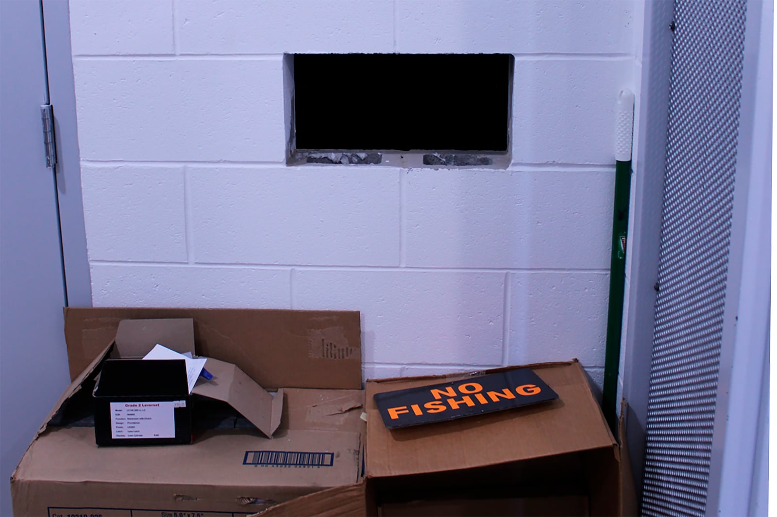 This undated photo provided by the Cullman County Sheriff's Office shows a hole on the wall next to the door to the evidence room at the Hanceville Police Department in Hanceville, Ala. Officials said the evidence room was not kept secure and could be accessed by the hole on the wall. (Cullman County Sheriff's Office via AP)