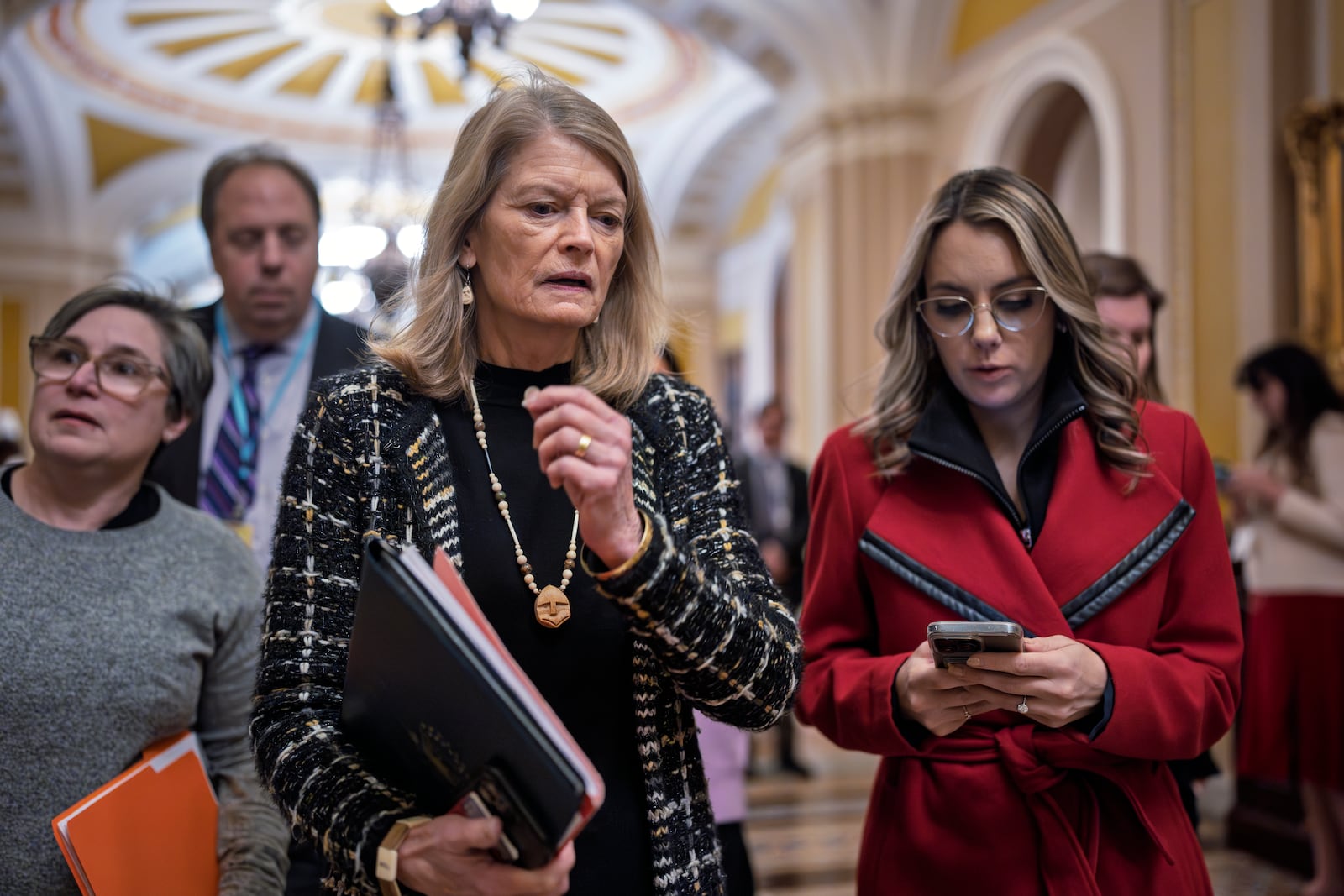 Sen. Lisa Murkowski, R-Alaska, walks to the chamber as senators gather for the final vote on Kash Patel, President Donald Trump's nominee to be FBI director, at the Capitol in Washington, Thursday, Feb. 20, 2025. (AP Photo/J. Scott Applewhite)