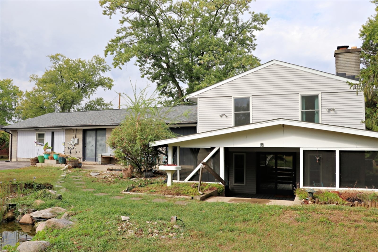 Listed for $350,000 by eXp Realty, the vinyl-and-brick, tri-level at 6220 Garber Road in Clayton has about 1,945 square feet of living space. The house sits well off the roadway on a 1.15-acre property. CONTRIBUTED.