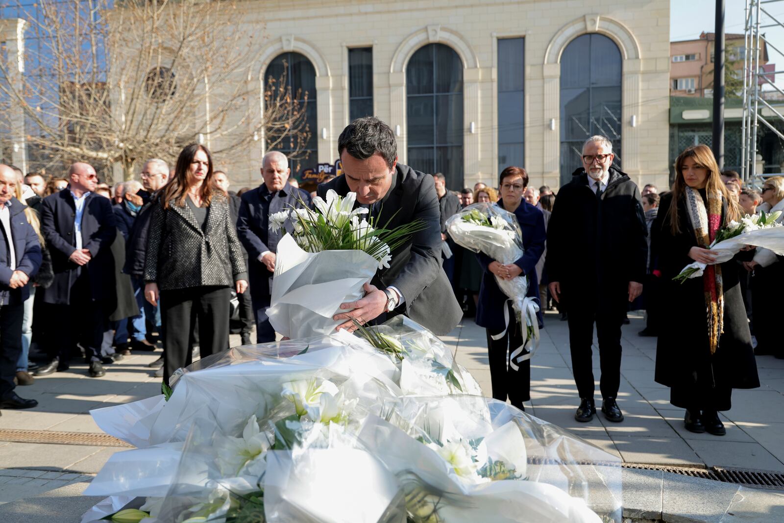 Kosovo's Prime Minister Albin Kurti, places flowers at Mother Teresa's square in Pristina, Kosovo, Monday, Feb. 10, 2025. (AP Photo/Vlasov Sulaj)