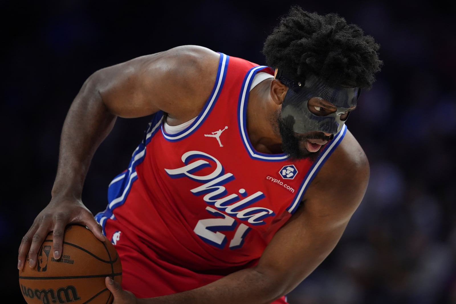 Philadelphia 76ers' Joel Embiid holds the ball during the second half of an NBA basketball game against the Charlotte Hornets, Friday, Dec. 20, 2024, in Philadelphia. (AP Photo/Matt Slocum)