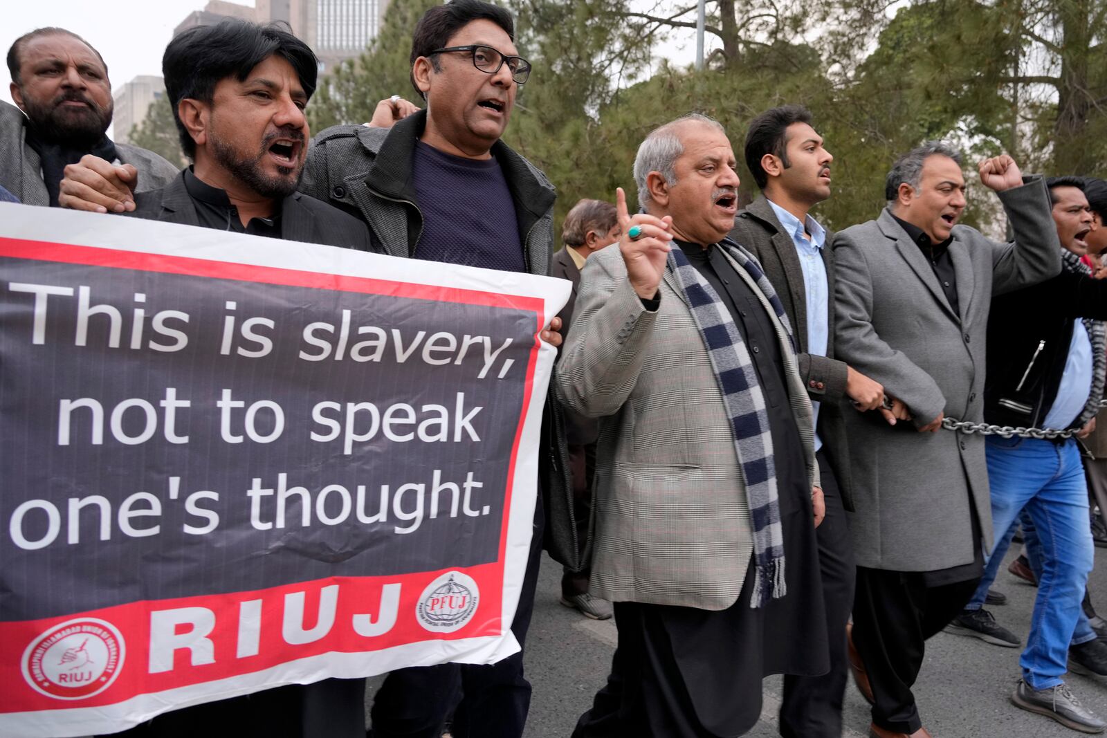 Journalists chant slogans during a protest rally, in Islamabad, Pakistan, Tuesday, Jan. 28, 2025 to condemn a controversial 'Prevention of Electronic Crimes Act' bill passed by parliament that critics argue is designed to suppress freedom of speech. (AP Photo/Anjum Naveed)