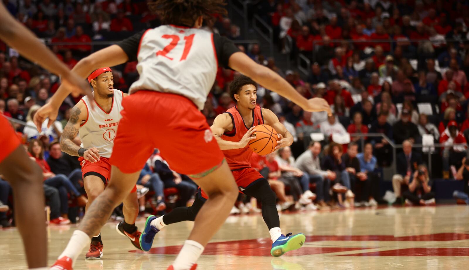 Dayton's Javon Bennett makes a pass against Ohio State an exhibition game on Sunday, Oct. 22, 2023, at UD Arena. David Jablonski/Staff