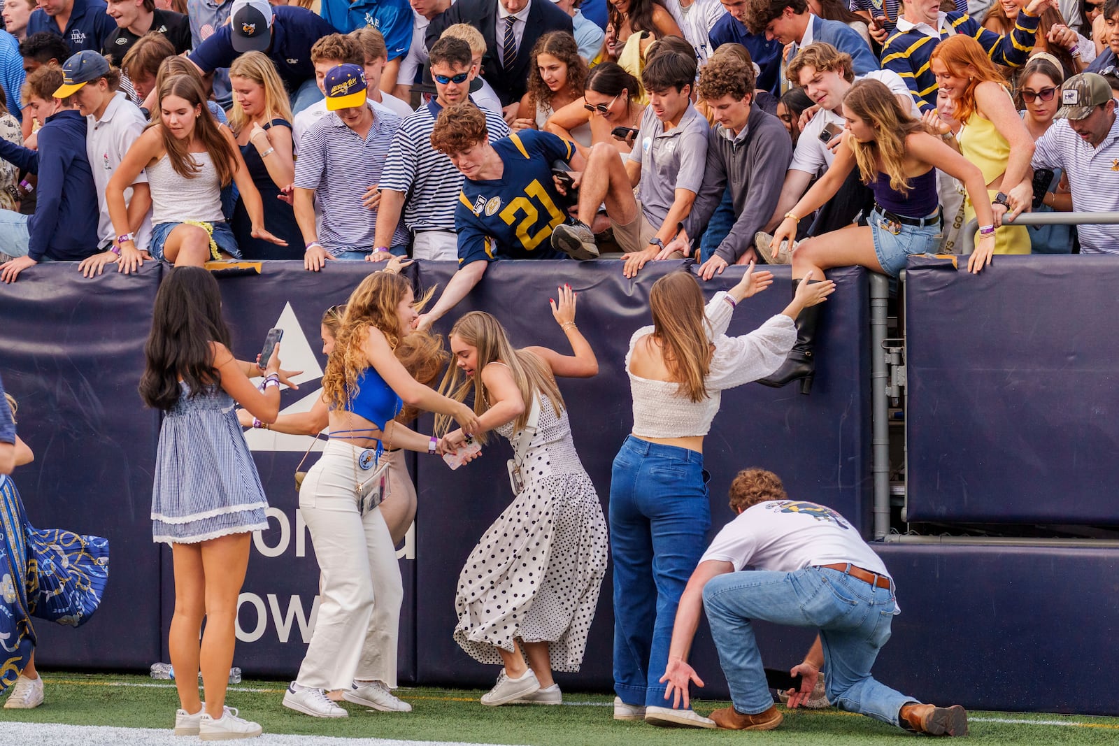 Georgia Tech fans rush the field following an NCAA football game against Miami, Saturday, Nov. 9, 2024, in Atlanta. (AP Photo/Jason Allen)