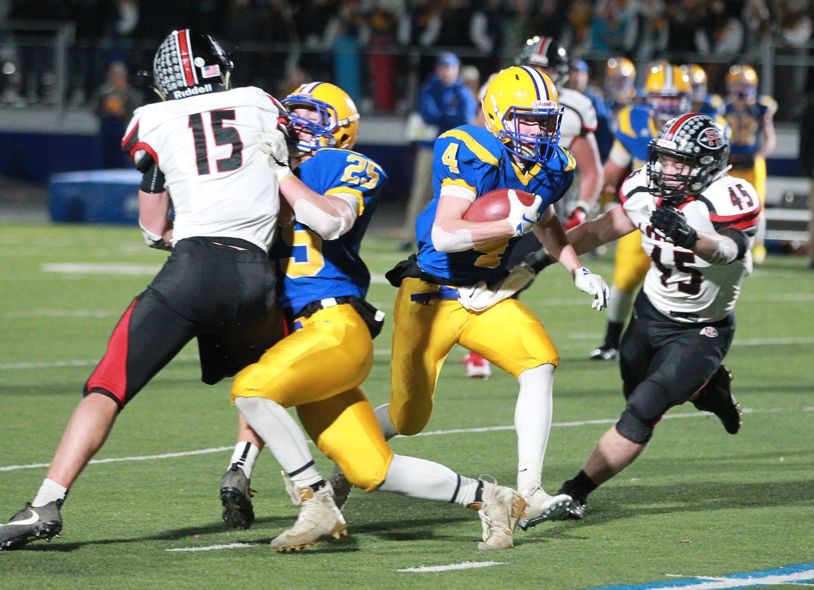 Peyton Otte of Marion Local (with ball) eludes Mark Seger (15) and Max Hoying (45) of Fort Loramie. Marion Local defeated Fort Loramie 24-21 in OT in a Division VII, Region 28 high school football regional semifinal at St. Marys Memorial on Saturday, Nov. 16, 2019. MARC PENDLETON / STAFF