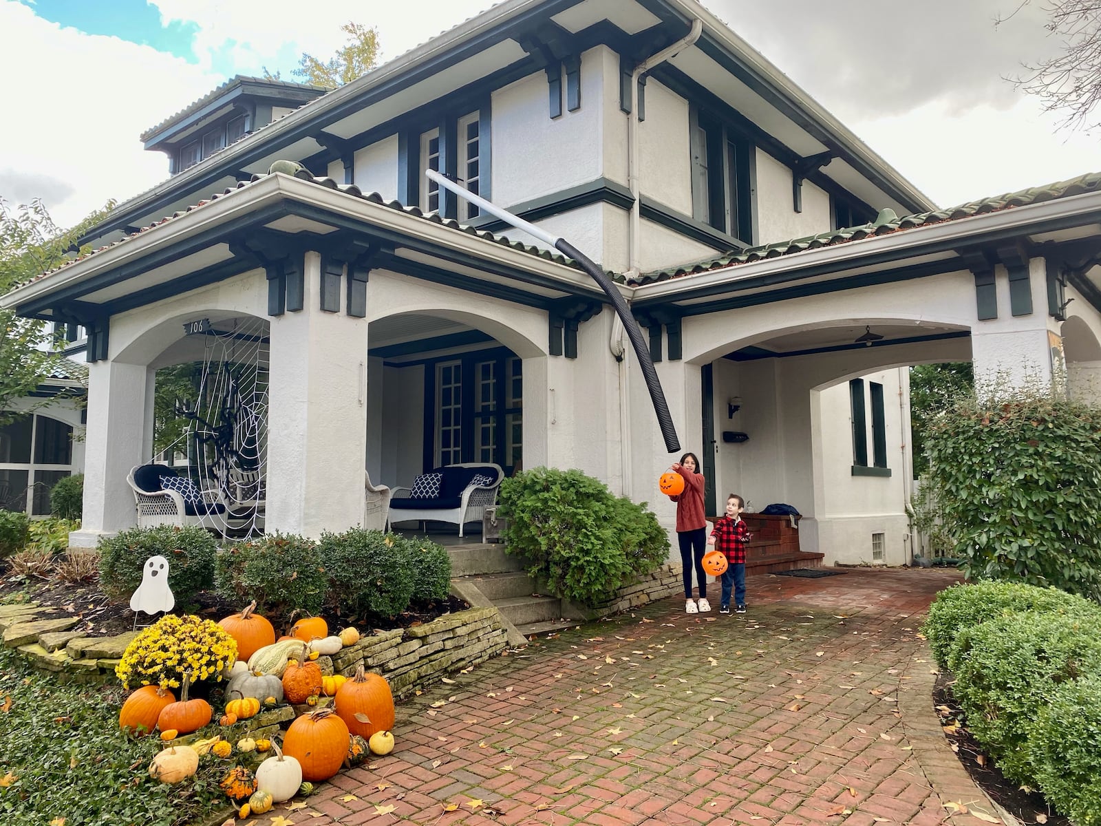 Charlotte Deutsch, 10, and Simon Deutsch, 4, show off their family's candy chute at their Oakwood home.