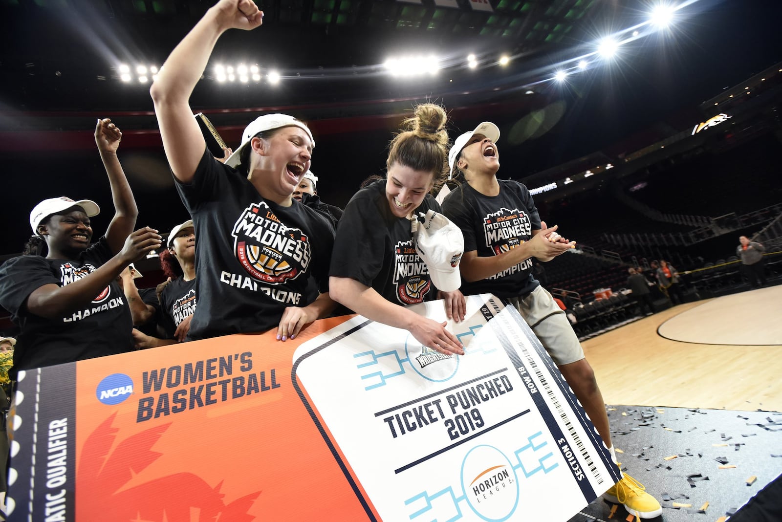 The Wright State women’s basketball team, including seniors (center) Mackenzie Taylor and Emily Vogelpohl, celebrate a win over Green Bay in the Horizon League championship game at Little Caesars Arena in Detroit. Jose Juarez/CONTRIBUTED