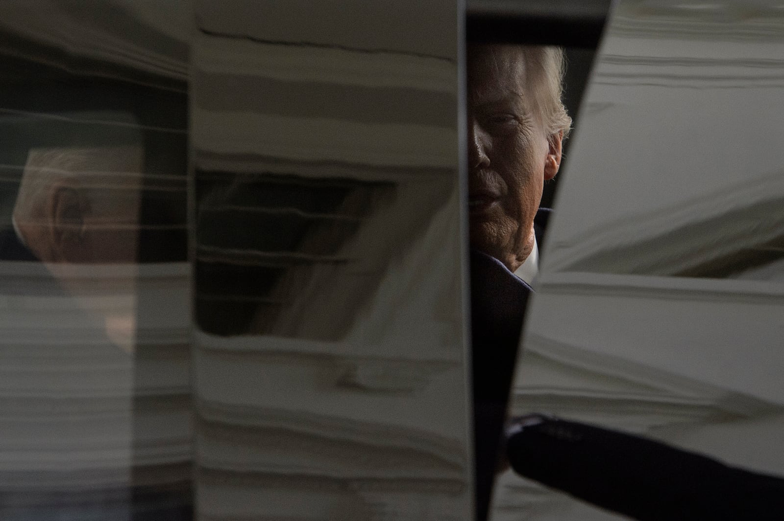 President-elect Donald Trump is seen in the presidential limousine as he and President Joe Biden depart the White House for the Capitol, Monday, Jan. 20, 2025, in Washington. (AP Photo/Rod Lamkey, Jr.)