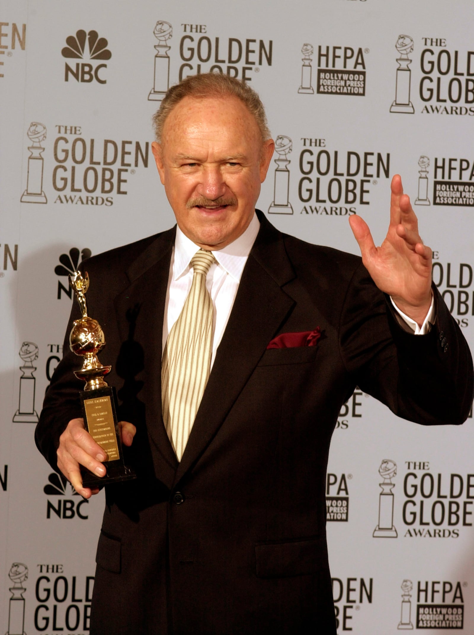 FILE - Gene Hackman holds his Cecil B. DeMille award at the 60th annual Golden Globe Awards in Beverly Hills, Calif. Sunday, Jan. 19, 2003. (AP Photo/Reed Saxon, File)