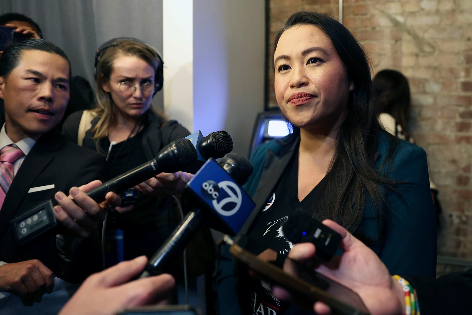 Oakland Mayor Sheng Thao, right, listens to a question from the media during an election night gathering at Fluid 510 in Oakland, Calif., Tuesday, Nov. 5, 2024. (Scott Strazzante/San Francisco Chronicle via AP)