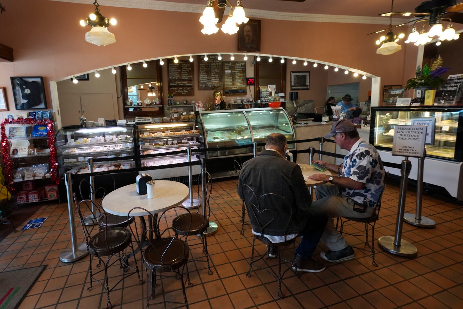 Patrons sit inside Angelo Brocato, in New Orleans, Wednesday, Jan. 29, 2025. (AP Photo/Gerald Herbert)