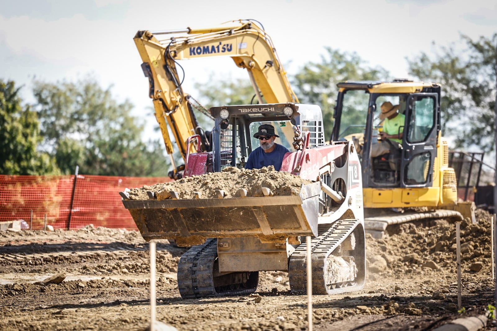 Workers level land that will be an expanded putting green at the Golf Club at Yankee Trace in Centerville Wednesday 13, 2023. JIM NOELKER/STAFF