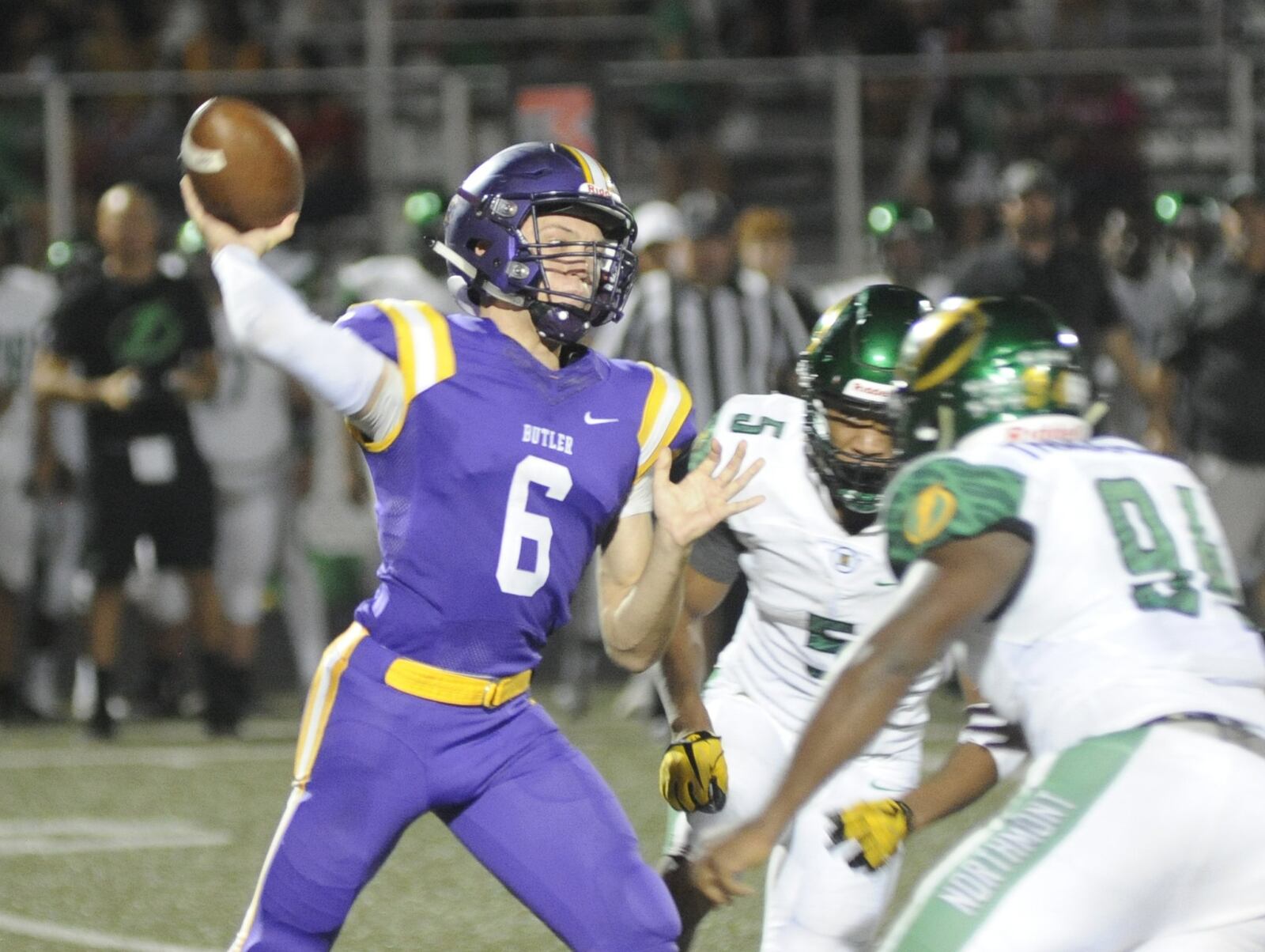 Northmont’s Jestin Jacobs (5) and Bryan Heyward close on Butler QB Mason Motter. Northmont defeated host Butler 43-16 in a Week 4 high school football game on Thursday, Sept. 13, 2018. MARC PENDLETON / STAFF