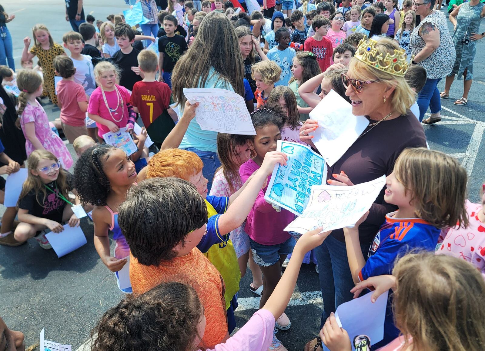 Ridgeway Elementary School principal Kathy Wagonfield was honored by teachers and hundreds of students Thursday, May 2, 2024 in Hamilton. She was surprised during a secret assembly to celebrate her. A tree was planted in her honor in front of the school. NICK GRAHAM/STAFF